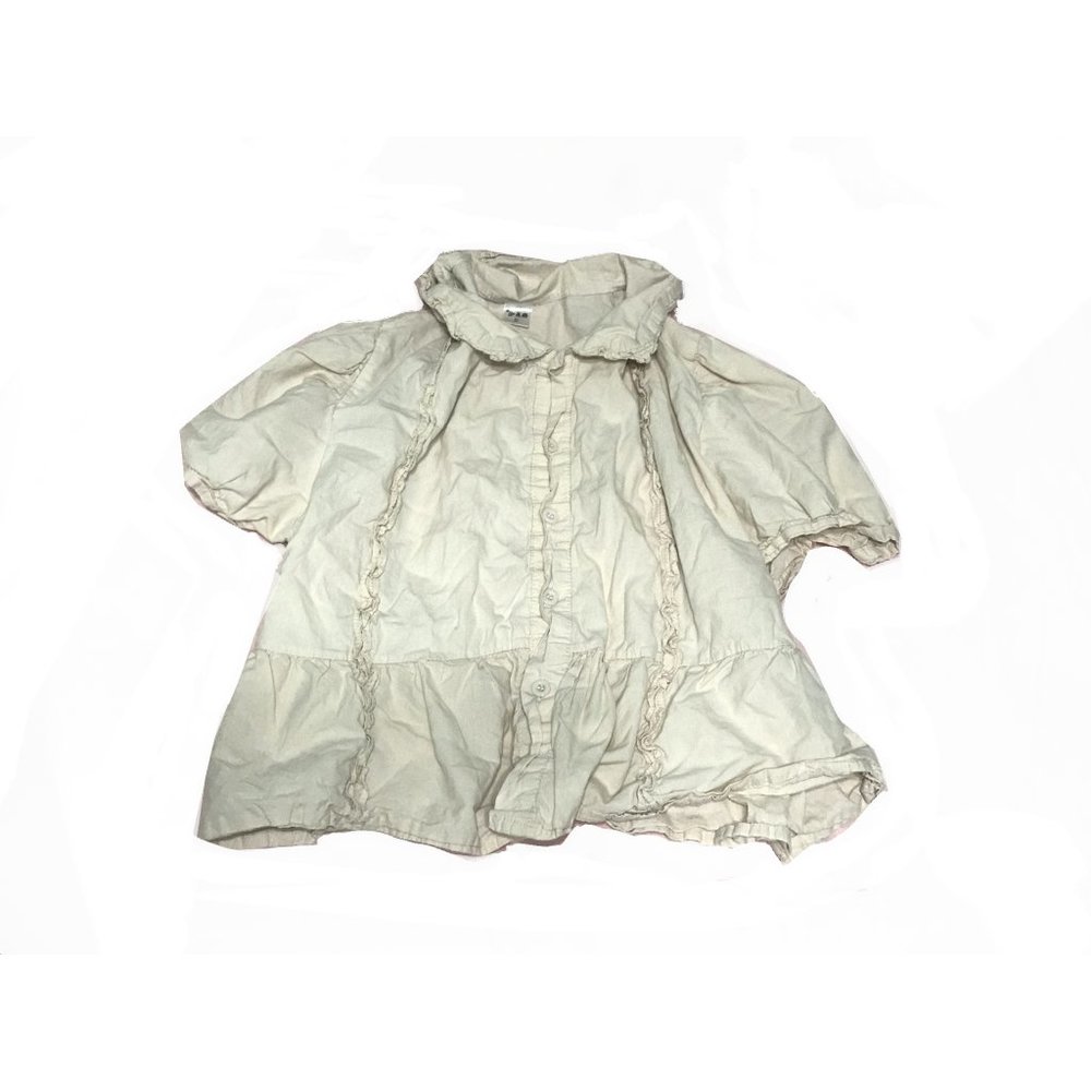 short-sleeved cream blouse